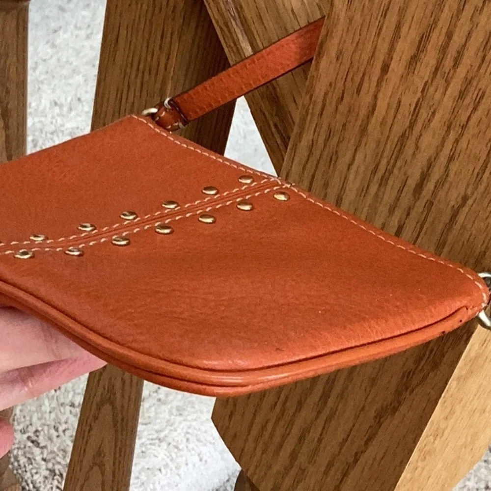 Michael Kors orange, gold tone Studded wristlet, clutch, zipper pouch